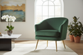 Emerald green velvet accent chair with gold legs in elegant living room